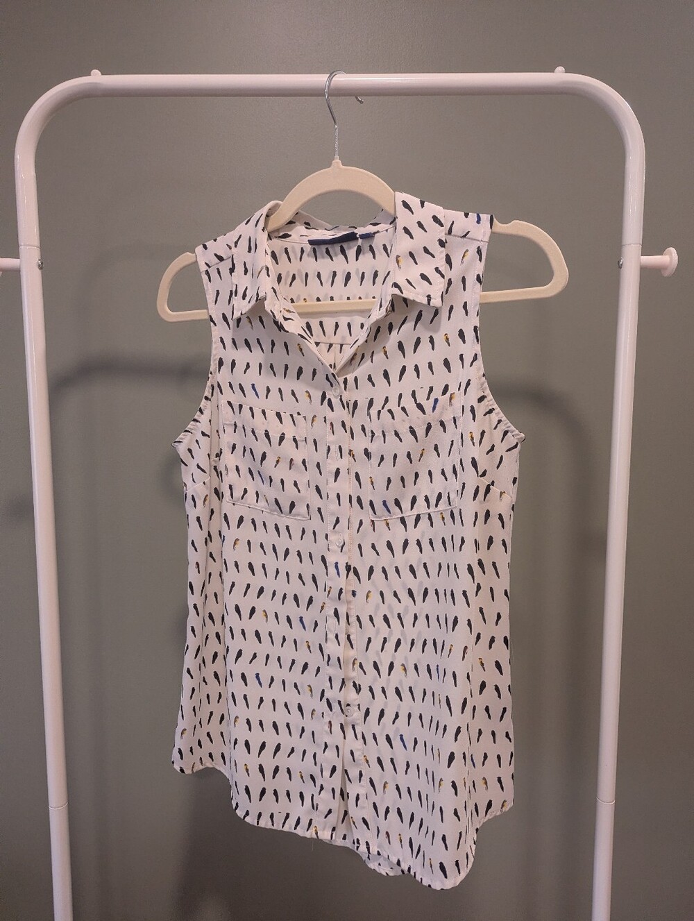 Sleeveless White Button-Front Blouse with Bird Print
